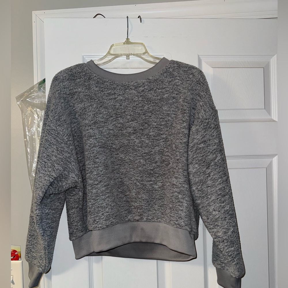 levi. size small. pullover. never worn. grey.